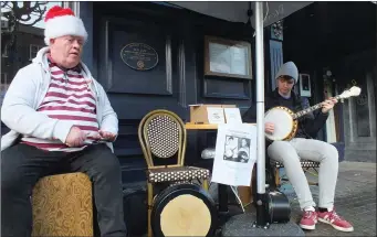  ??  ?? Johnny Bongos and Eoin Turner performing in the town centre at Christmas.