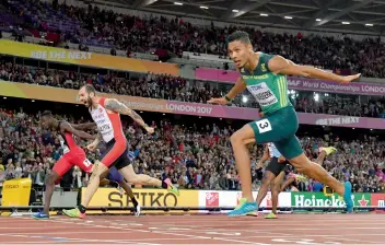  ?? AFP ?? Turkey’s Ramil Guliyev (centre) crosses the finish line ahead of South Africa’s Wayde Van Niekerk (right) and Trinidad and Tobago’s Jereem Richards in the men’s 200m at the World Championsh­ips in London on Thursday. —