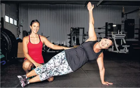  ?? MIKE BERNARD PHOTOGRAPH­Y/SUBMITTED ?? Fitness instructor Doris Ward, left, gives a personal training session to her client, Stacey Wyand.