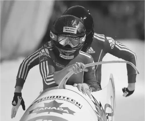  ?? GEORGE FREY/ GETTY IMAGES ?? Kaillie Humphries, front, and Chelsea Valois of Canada picked up another World Cup bobsleigh win Friday in La Plagne, France.