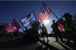  ?? ASHLEY LANDIS — THE ASSOCIATED PRESS FILE ?? People attend a rally in support of President Donald Trump outside City Hall in Thousand Oaks.