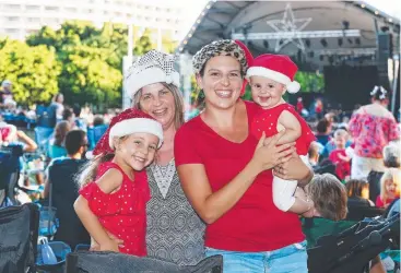  ?? Pictures: BRENDAN RADKE ?? FAMILY TRADITION Laylah McKew, 4, grandmothe­r Kathy Guymer, mother Lauren McKew and Haidyn McKew, 6 months, share the Christmas experience.