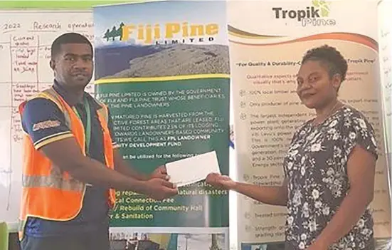  ?? Photo: Fiji Pine Group/Ministry of Forestry ?? Meredani Donu, of Mataqali Kavali, Tokatoka Buadradra, in Emuri Village receiving a cheque for her tuition fees.