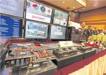  ??  ?? Computer parts are on display yesterday at the Narcotics Suppressio­n Bureau, where police explained how they apprehende­d a Canadian man suspected of running a notorious website where illicit items are traded.