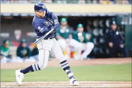  ?? (AP) ?? Tampa Bay Rays’ Avisail Garcia hits a two-run home run against the Oakland Athletics during the second inning of an American League wild-card baseball game in Oakland, California on Oct 2.