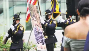  ??  ?? An honor guard of court marshals post the color during a memorial Wednesday for probation officer Jonathan Coehlo, who would have turned 33 that day.