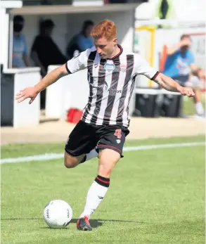  ?? PICTURES: Simon Howe ?? Tom Smith lines up a shot during the 2-1 defeat to Dorking Wanderers in the play-off eliminator