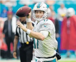  ?? JIM RASSOL/STAFF FILE PHOTO ?? Ryan Tannehill had 19 touchdowns, 12 intercepti­ons and a career-best 93.5 passer rating during his first year under head coach Adam Gase.