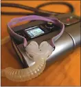  ??  ?? The sleep apnea breathing device that Joelle Dobrow uses at her home in Los Angeles lies on her bed.