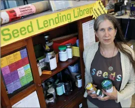  ?? ANDA CHU — STAFF PHOTOGRAPH­ER ?? Rebecca Newburn’s Richmond Grows Seed Lending Library inside the Richmond Public Library offers vegetable, flower and herb seeds free to anyone who wants to grow them.