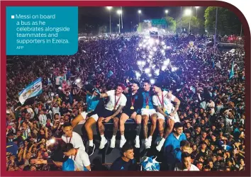  ?? ?? Messi on board a bus as he celebrates alongside teammates and supporters in Ezeiza.