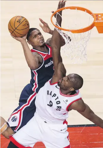  ?? NATHAN DENETTE/THE CANADIAN PRESS ?? Toronto Raptors forward Serge Ibaka, pictured defending Washington’s Bradley Beal in Game 1 of their playoff series, has become an integral part of the Raptors’ success story this season, and recorded a team-high 23 points in their opening game victory...