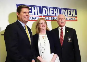  ?? BOSTON HERALD FILE ?? GRIEF-STRICKEN: Maureen Maloney, center, of Milford, whose son Matthew Denice, left, was killed in 2011 by an illegal immigrant, stands between Geoff Diehl, above left, and Bristol Sheriff Thomas Hodgson.