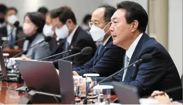  ?? — AP ?? Special service: Yoon speaks during a cabinet meeting at the presidenti­al office in Seoul. The South Korean government says that if companies like Tesla and Space X set up shop in the country, it would present a tailored approach to grant them advantages.