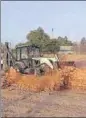  ??  ?? Walls around the encroached Wakf Board land being razed in Bathinda on Sunday. HT PHOTO