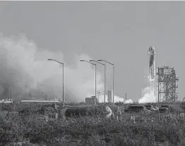  ?? Joe Raedle / Tribune News Service ?? Blue Origin’s New Shepard rocket lifts off with founder Jeff Bezos and his brother Mark on board July 20 in Van Horn.