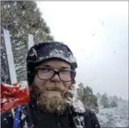  ?? BRIEN BOWER VIA AP ?? In this May 15selfie shows hiker Brien Bower in a snow storm along Pacific Crest Trail in California’s southern Sierra Nevada. Bower, who hiked the 2,600-mile trail in 2015, detoured from the trail this spring after being caught in an avalanche and...