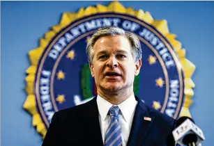  ?? JOHN C. CLARK/AP ?? FBI Director Christophe­r Wray speaks at the FBI Norfolk Field Office in Chesapeake, Virginia, one of the bureau’s 56 field offices. He conveys a “keep calm and tackle hard” mantra.