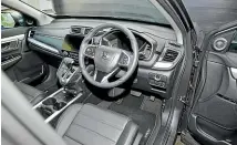  ??  ?? The CR-V’s interior remains functional, but is somewhat drab and occasional­ly ergonomica­lly odd.