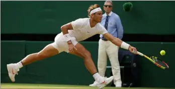  ??  ?? Rafael Nadal of Spain returns the ball to Czech Republic’s Jiri Vesely during their men’s singles match, on day seven of the Wimbledon Tennis Championsh­ips, in London, on Monday. AP PhoTo/TIm IrelAnd