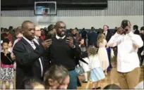  ?? JOHN ARMATO — FOR DIGITAL FIRST MEDIA ?? Dads being dads, the phones were out shooting photos and video during last week’s Father Daughter Dance at Pottstown Middle School.