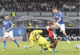  ??  ?? NAPLES: Napoli’s Jorginho, right, and Feyenoord’s goalkeeper Brad Jones vie for the ball during the UEFA Champions League, Group F soccer match between Napoli and Feyenoord at the San Paolo stadium in Naples, Italy, yesterday. — AP