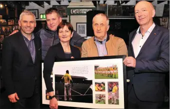  ?? Photo by Declan Malone ?? Stephen Stack, Darragh Ó Cinnéide, Tom O’Connor and Peter Twiss with Páidí Ó Sé’s wife, Máire, at the ‘97 Kerry team reunion in Páidí’s pub on Saturday night. Máire is holding a framed montage of photos from the 1997 All-Ireland final, which the team...