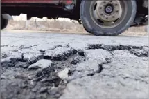  ?? Hearst Connecticu­t Media file photo ?? New Milford officials are partnering with website and app company SeeClickFi­x in an effort to help residents report potholes and hazardous conditions in town.