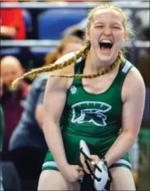  ?? O-N-E PHOTOS BY MICHELLE THOMPSON ?? Bandys High sophomore Kaylah Evans (right photo) standing on the podium (in hat) as she placed 3rd in the 145 pound class at the inaugural NCHSAA Women’s Wrestling State Championsh­ips in Greensboro on Feb. 17.