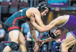  ??  ?? Antonio Saldate, left, a Las Vegas senior, avenged his 2017 state final loss to Jacob Ruiz of Spanish Springs in the 126-pound championsh­ip match.