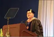  ?? KEVIN MARTIN — THE MORNING JOURNAL ?? Keynote speaker Michael J. Brown addresses LCCC graduates at the 54th annual commenceme­nt ceremony on May 12. Brown, president of Barrick Gold of North America, attended LCCC from 1976-1978 and received his associate of arts degree.