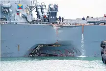  ?? U.S. NAVY PHOTO VIA ASSOCIATED PRESS ?? Damage to the portside is visible as the USS John S. McCain steers toward Changi naval base in Singapore on Monday following a collision with an oil tanker in Southeast Asian waters.