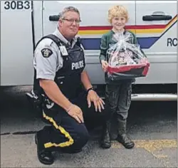  ?? SUBMITTED PHOTO ?? James Ross was the art contest winner in the Primary to Grade 2 category in North East Nova. The contest was held by RCMP “H” Division over the past few weeks. He was presented with a gift basket from RCMP Const. Paul Vanderlaan and was given a tour of...