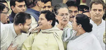  ?? PTI FILE ?? BSP president Mayawati, flanked by West Bengal chief minister Mamta Banerjee and RJD leader Tejashwi Yadav, at the swearingin of Karnataka chief minister HD Kumaraswam­y. Congress leaders Sonia Gandhi and Rahul Gandhi can be seen behind them.