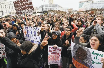  ?? Michael Short / Special to The Chronicle ?? Students cheer as they gather in front of San Francisco City Hall to advocate for stricter laws on guns.