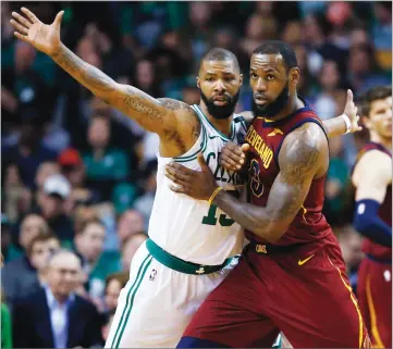  ?? AP PHOTO BY MICHAEL DWYER ?? Cleveland Cavaliers forward Lebron James, right, fights for position against Boston Celtics forward Marcus Morris (13) during the third quarter of Game 1 of their NBA Eastern Conference Finals, Sunday in Boston.