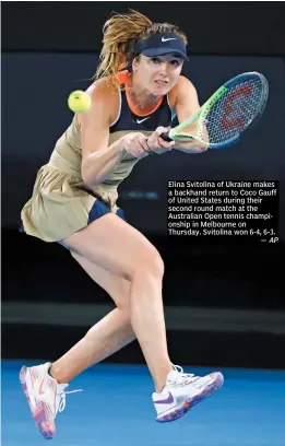  ?? AP ?? Elina Svitolina of Ukraine makes a backhand return to Coco Gauff of United States during their second round match at the Australian Open tennis championsh­ip in Melbourne on Thursday. Svitolina won 6-4, 6-3.
—