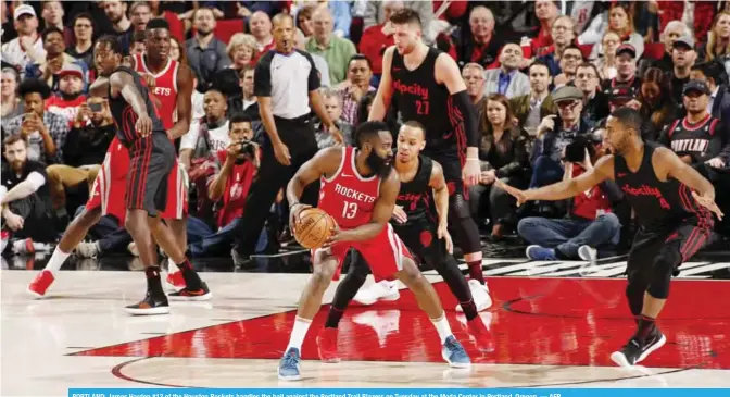  ?? — AFP ?? PORTLAND: James Harden #13 of the Houston Rockets handles the ball against the Portland Trail Blazers on Tuesday at the Moda Center in Portland, Oregon.