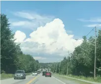  ?? CINDY DAY ?? This towering cumulus cloud in Cole Harbour, N.S., is the type of cloud that would give you a sun shower.