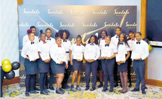  ?? CONTRIBUTE­D ?? Participan­ts in the USAID ‘Positive Pathways’ Programme gather for a group photo at a recent graduation ceremony at Sandals Montego Bay. The youngers received certificat­es and letters of recommenda­tion from Sandals after completing a six-week hospitalit­y training programme.