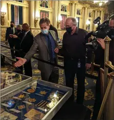  ?? COURTESY OF MARK M. GILLEN ?? State Rep. Mark M. Gillen, left, of Berks County chats with Herbert Logan, a state Capitol worker, on Internatio­nal Holocaust Remembranc­e Day on Jan. 27. Holocaust artifacts from the Berks Military History Museum were on display in the Capitol.