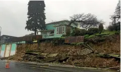  ?? PHOTO: STU OLDHAM/ STUFF ?? A retaining wall collapsed on Douglas St due to heavy rain.