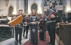  ??  ?? The Mariachi Internacio­nal de Pittsburgh plays at the start of Mass at St. Paul Cathedral.