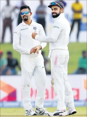  ?? AFP ?? India captain Virat Kohli (R) celebrates with Ravindra Jadeja after the dismissal of opener Upul Tharanga at Galle on Friday.