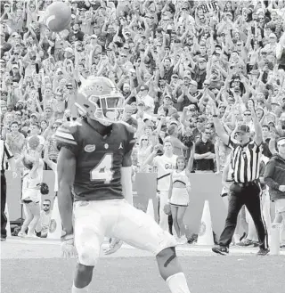  ?? SAM GREENWOOD / GETTY ?? Florida’s Kadarius Toney crosses the goal line for a touchdown against South Carolina at Ben Hill Griffin Stadium. He is considered a potential first-round pick in April’s NFL draft.