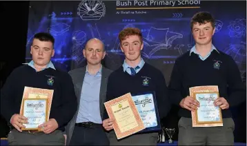  ??  ?? Dylan Tuite, Winner together with Oisín Murphy and James Keenan, Highly Commended receive their Bellurgan Precision Engineerin­g Junior Cert award from Paul Kelly at the Bush Post Primary Annual School Awards for 2018.