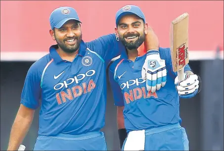  ?? PTI PHOTO ?? Virat Kohli (right) and Rohit Sharma have scored over 1,000 ODI runs this year at an average of over 70.