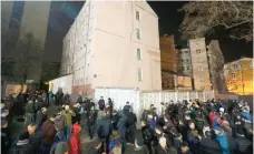  ?? — Reuters ?? People gather outside a court building to prevent the release of head of Ukraine’s tax and customs service Roman Nasirov, who is under investigat­ion over the suspected embezzleme­nt, in Kiev.