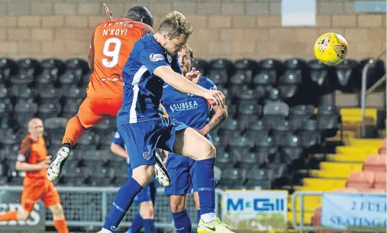  ?? Pictures: SNS Group. ?? Patrick N’Koyi rises above the Cowden defence to head home Willo Flood’s cross and put United 2-0 up.