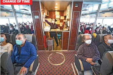  ?? (AFP) ?? Hong Kong tourists riding a ferry heading from Hong Kong to the southern Chinese enclave of Macau